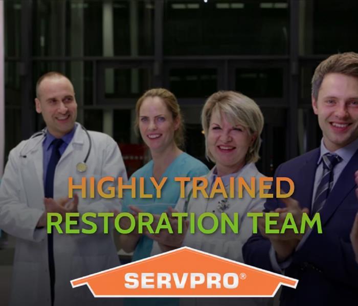 Staff clapping for graduates of our SERVPRO training Program.